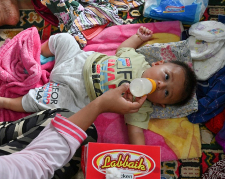 Sick, hungry Indonesia tsunami survivors cram shelters