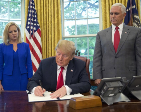 In reversal, Trump orders halt to his family separation rule