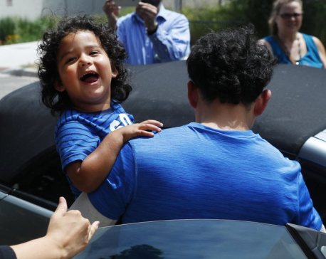 Reunited immigrant children scooped up into parents’ arms