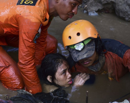 Burials begin in quake- and tsunami-hit Indonesian region
