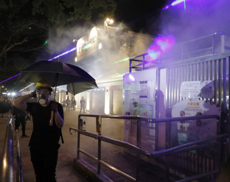 HK police fire tear gas at protesters as marchers defy ban