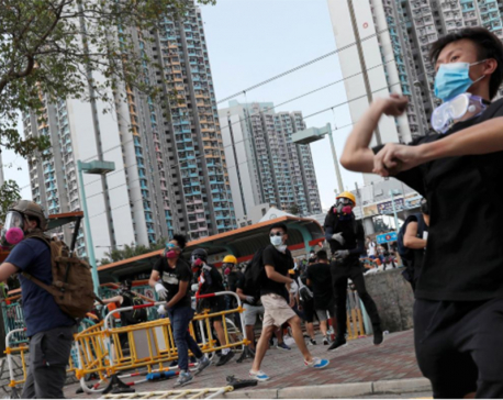Hong Kong police fire tear gas as strikes paralyze city