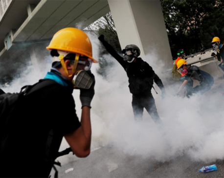 Tear gas fired, bricks thrown in Hong Kong clash over banned march