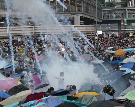 Protesters scuffle with Hong Kong police, government offices shut