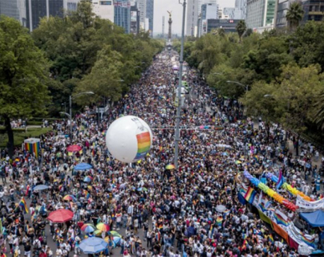 Tens of thousands join gay pride parades around the world