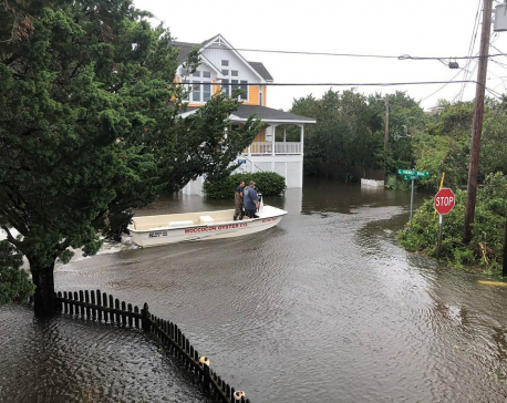 Dorian’s floodwaters trap people in attics in North Carolina