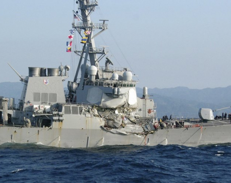 Search on for 7 Navy crew after ship damaged in collision
