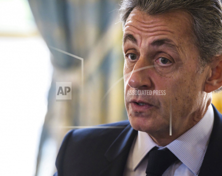 Ex-French president Sarkozy held on Gadhafi claims - source