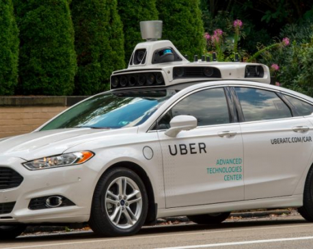 Uber suspends self-driving car tests after woman dies in Arizona