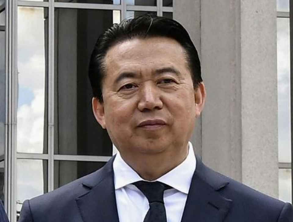 Chinese court jails former Interpol chief for 13-1/2 years over graft