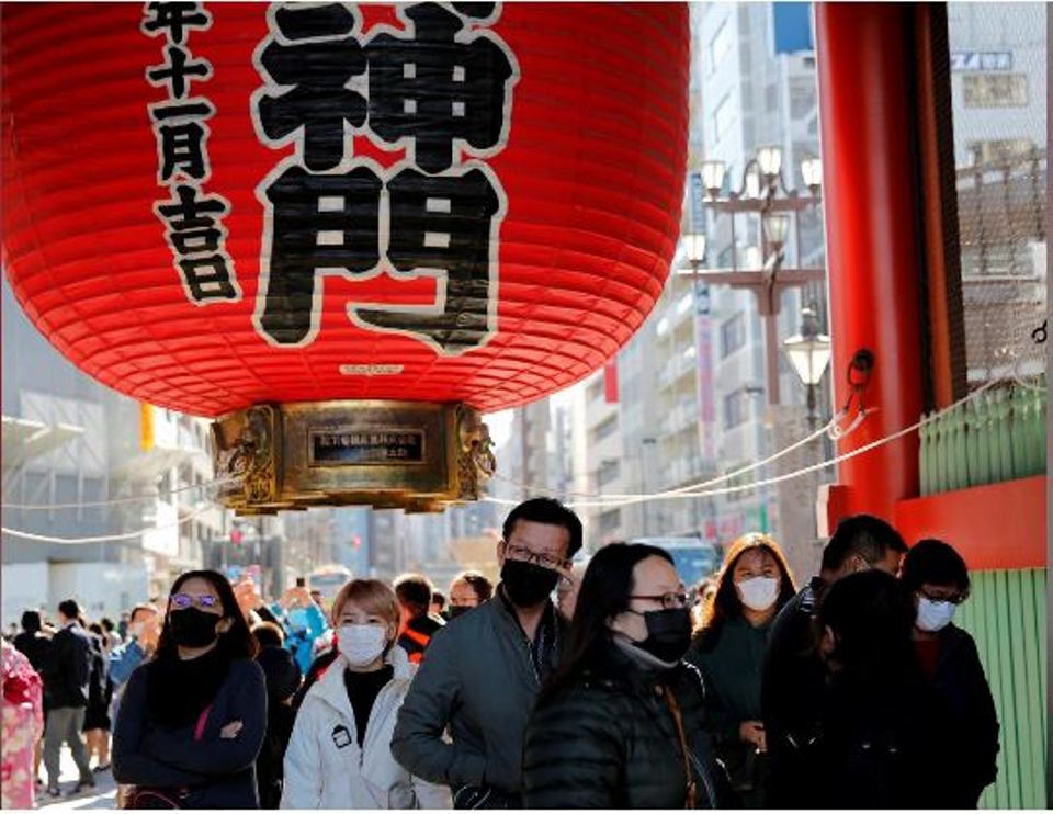 Japan to enforce special virus measures from Sat, urges citizens against non-urgent China trips