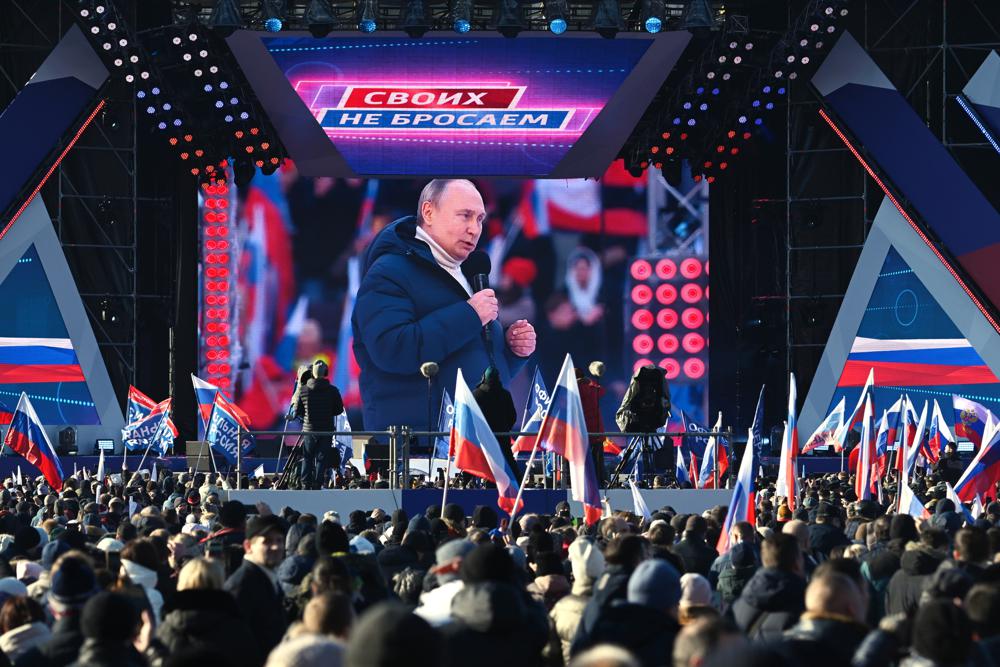 Putin appears at big rally as troops press attack in Ukraine