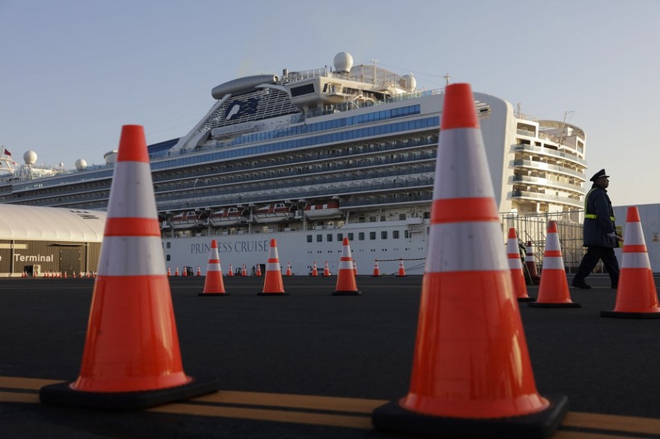 Quarantine on cruise ship in Japan comes under question
