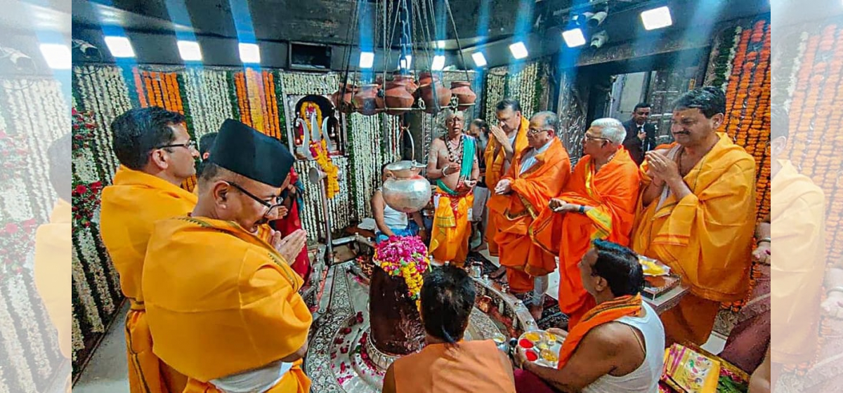 Sharing a photo of PM Dahal worshiping in the temple in India, Dr Baburam Bhattarai asks: “Where are we going?”