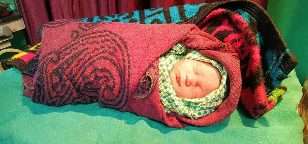 Newborn  baby found  abandoned  with umbilical cord still attached
