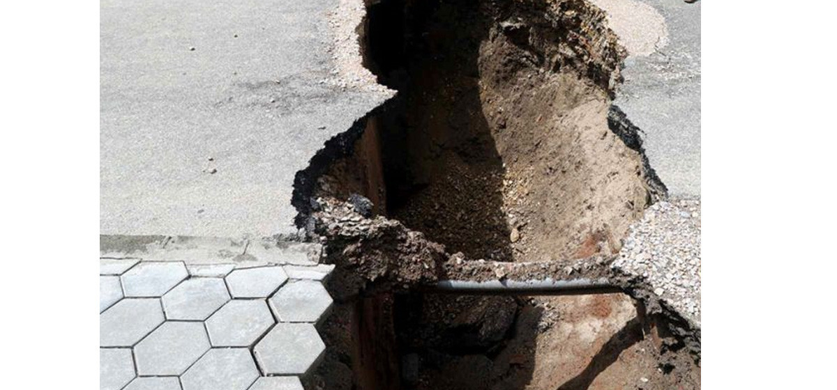 Traffic halted after road caves in near KMC Office