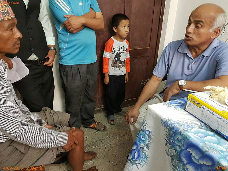 Dr KC providing free medical treatment in Rolpa