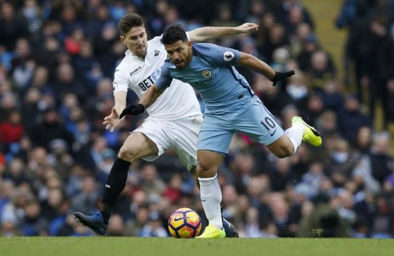 Jesus double lifts City to third with late Swansea win