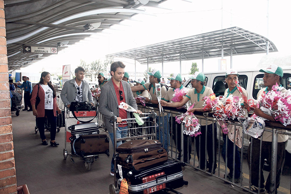 FAN distributes free bouquets to passengers at airport in Kathmandu