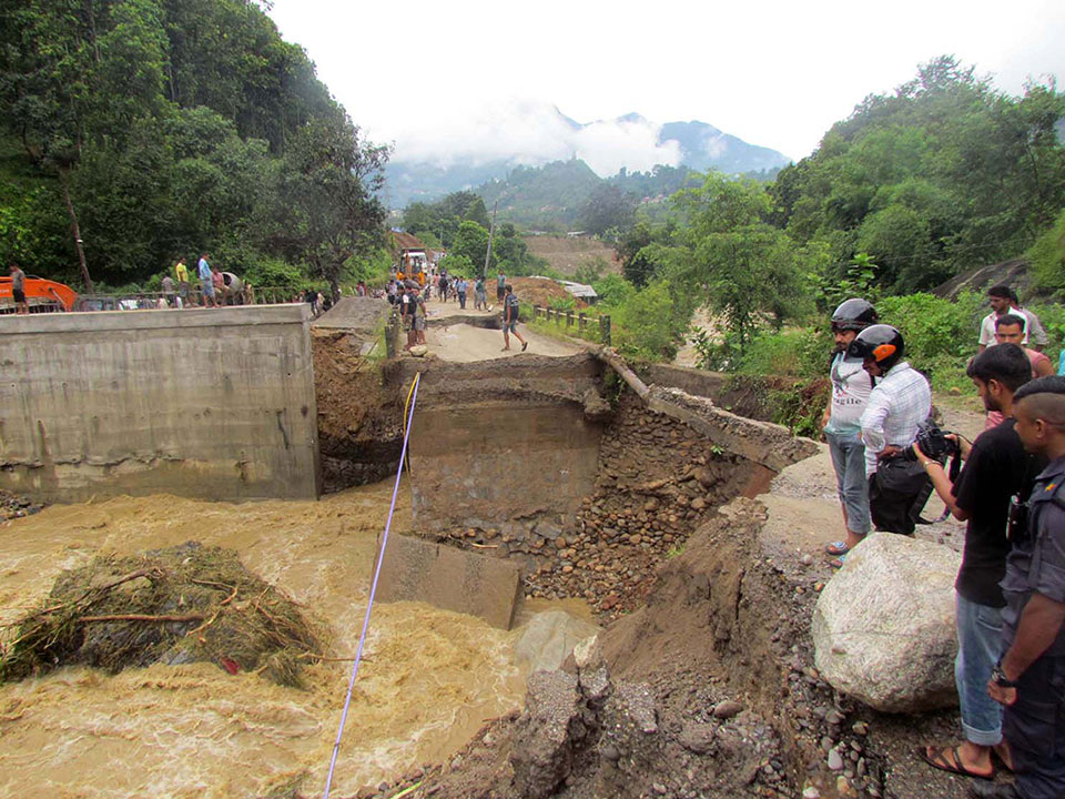 Flood damages bridge, afflicting people including Gosaikunda pilgrims