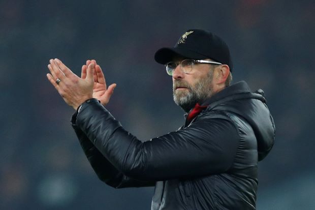 Klopp plays down six-point lead for title-chasing Reds