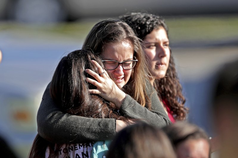Former student opens fire at Florida high school, killing 17