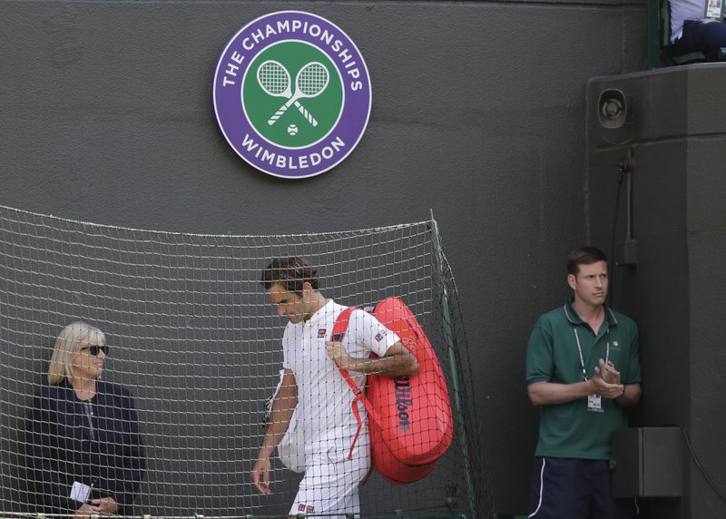 Federer stunned in Wimbledon QF; Nadal, Djokovic, Isner win