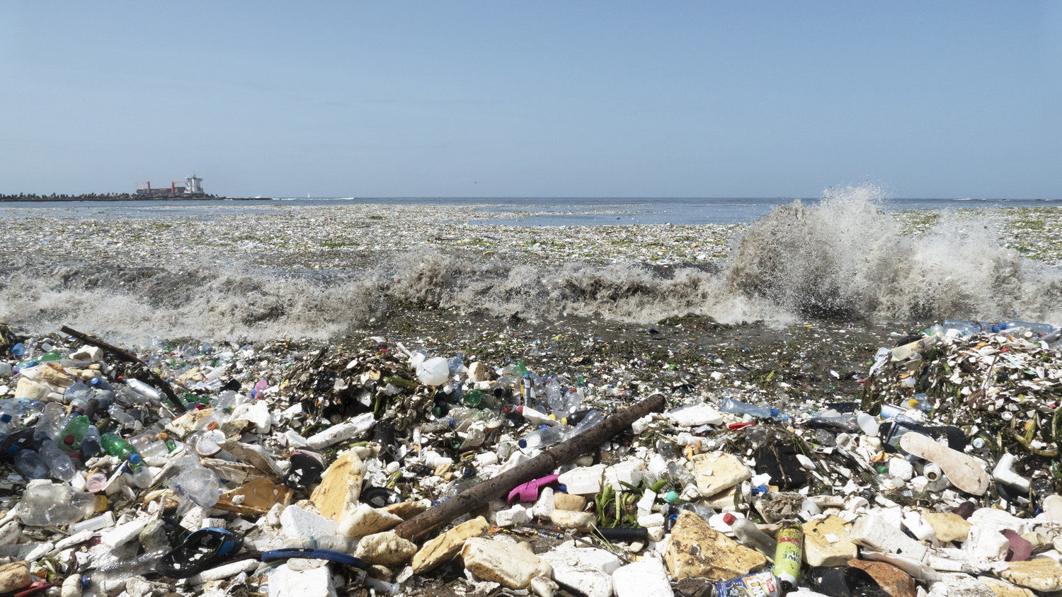 Waves of garbage are washing onto a beach in the Dominican Republic