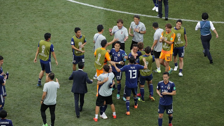 Japan squeeze into last 16 on disciplinary rule