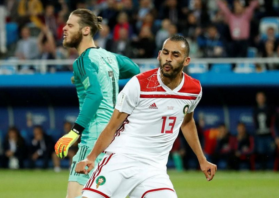 Spain snatch 2-2 draw with Morocco to top group