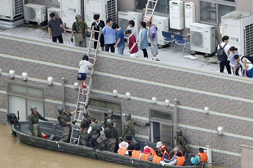 Death toll rises to nearly 100 as Japan scrambles to rescue flood victims