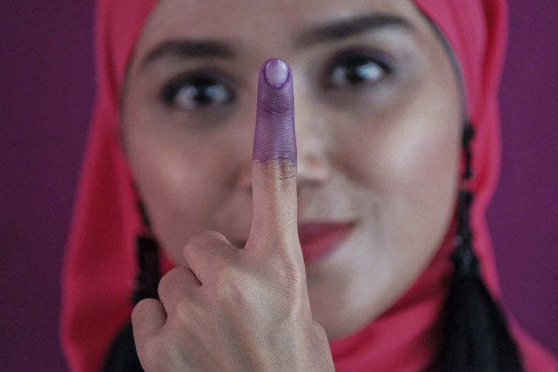 Malaysians vote in election defined by graft scandal, tax