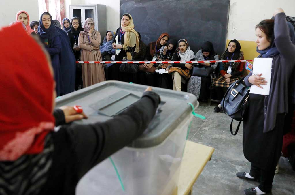Afghans vote amid chaos, corruption and Taliban threats