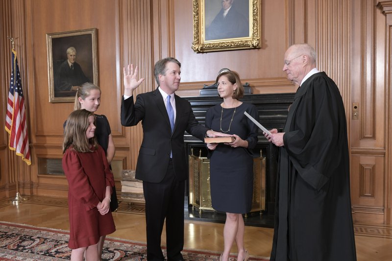 Kavanaugh sworn in as protesters chant outside Supreme Court