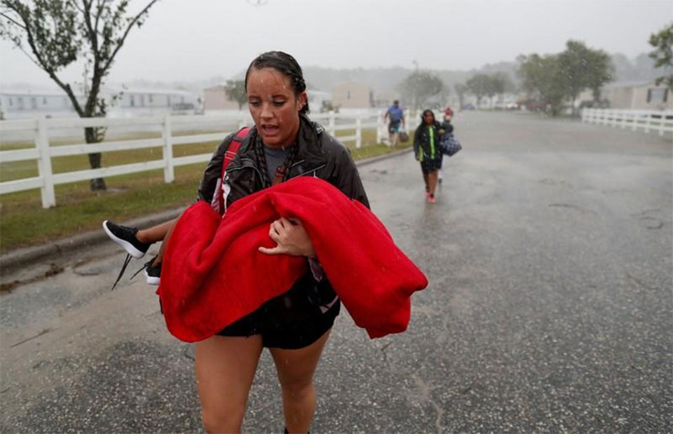 Flood waters rise as Florence pummels Carolinas; at least eight dead
