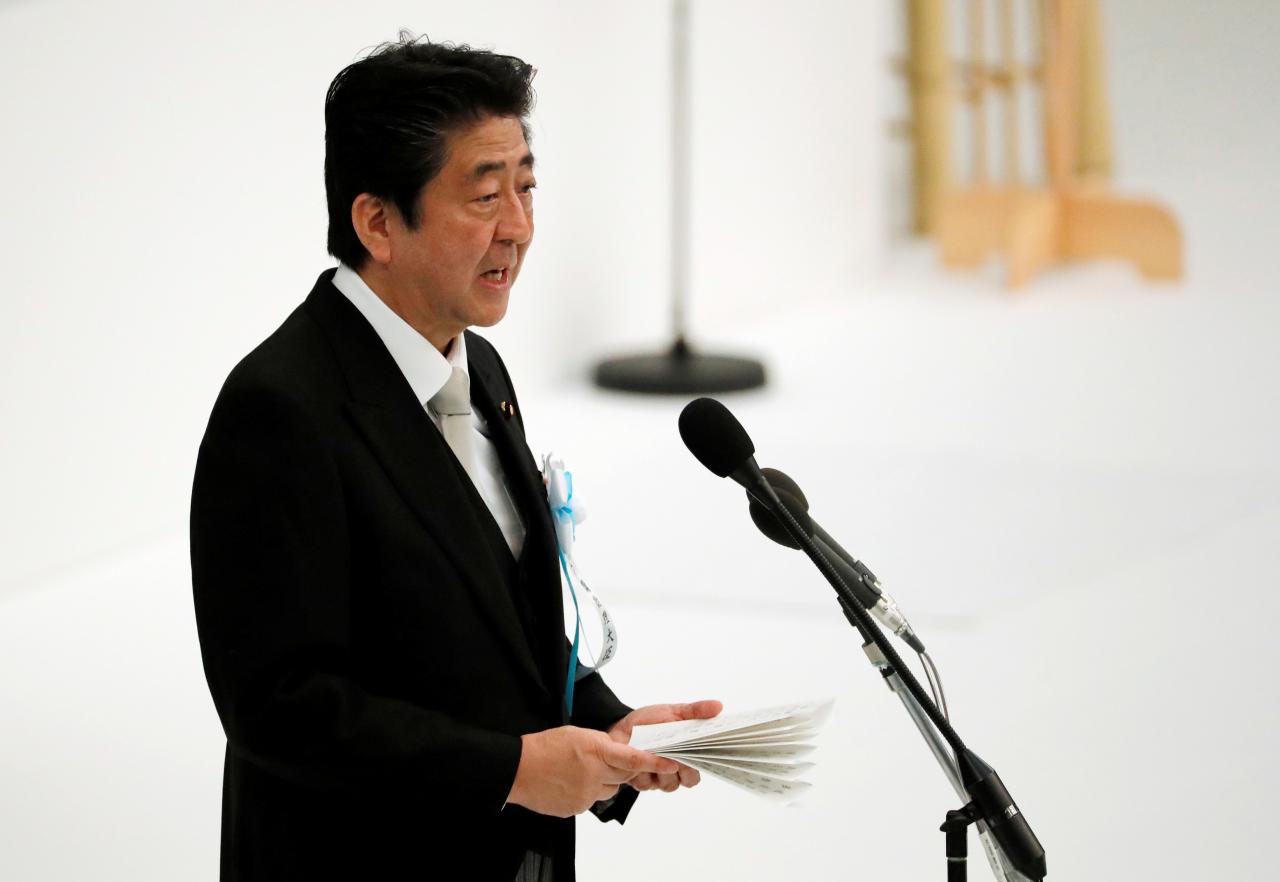 Japan PM Abe says relations with China back on 'normal track'