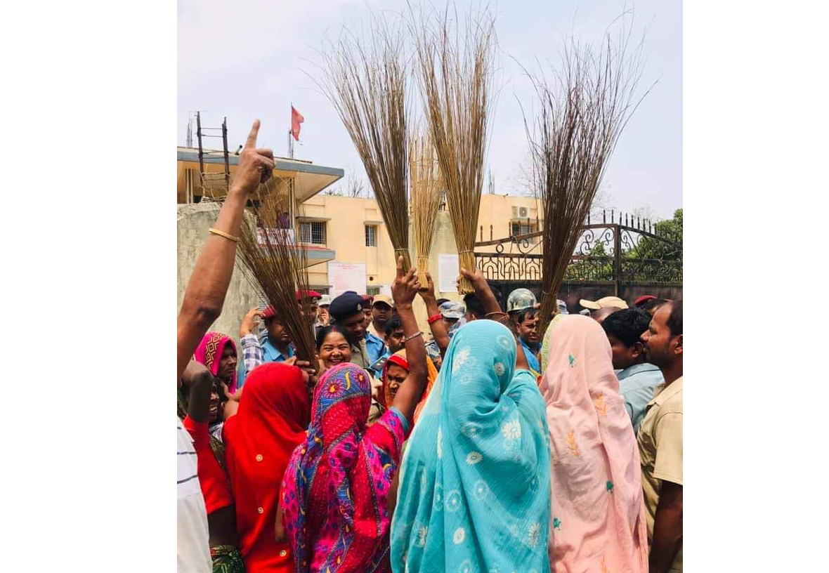 Brooms in hands, women protest against mayor