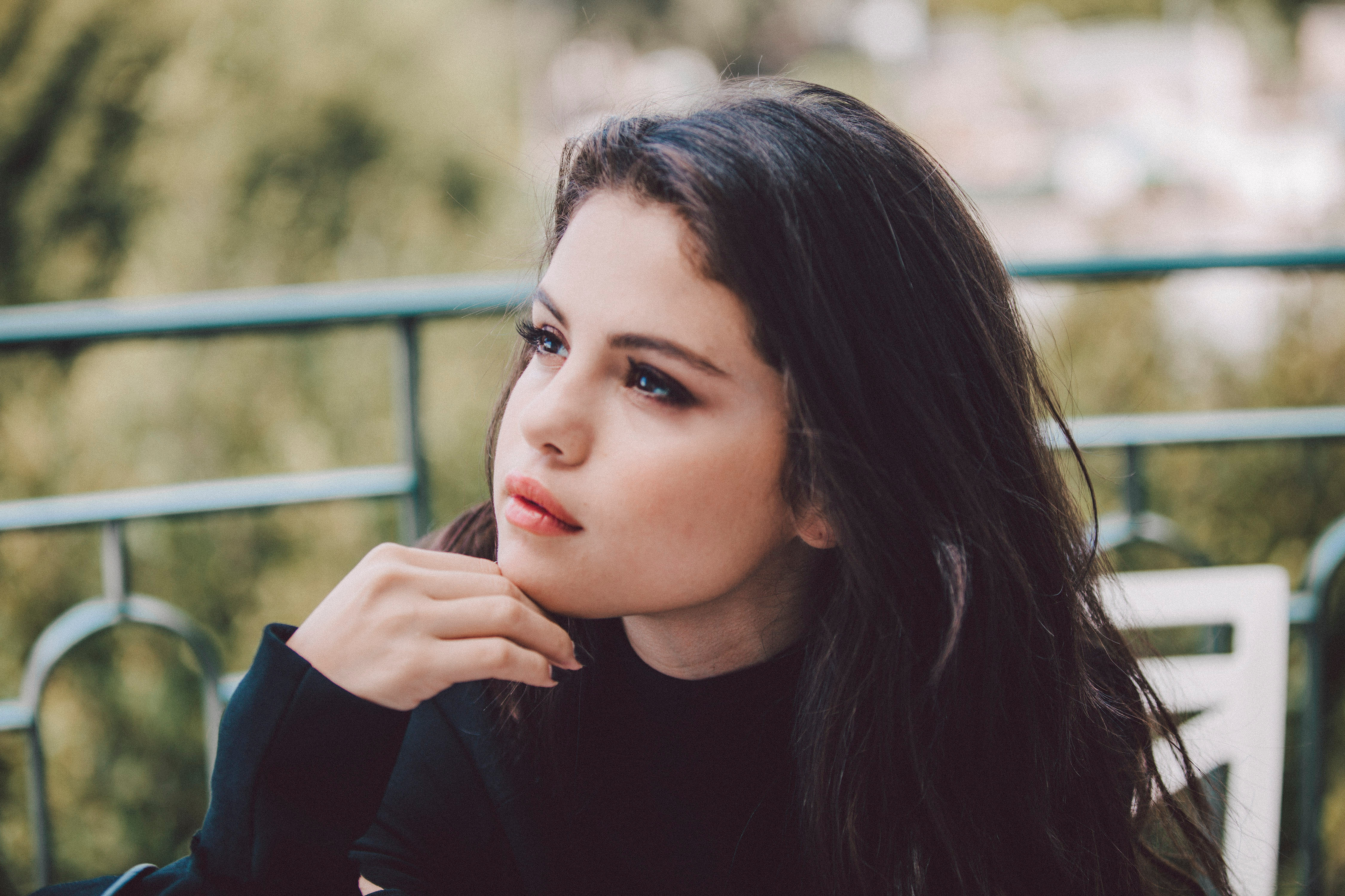 Selena Gomez says she gets in "trouble" when she talks about her music