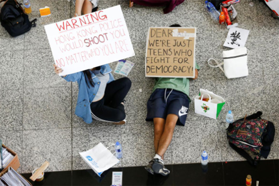 Hong Kong airport reopens amid warnings over pro-democracy protests