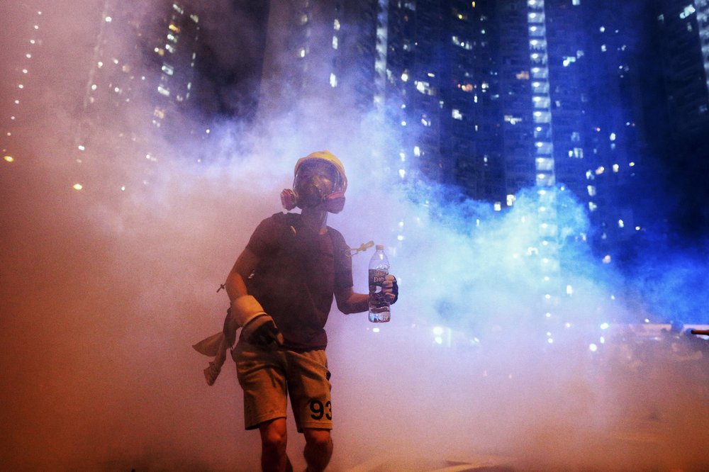 Hong Kong police arrest over 20 protesters in new scuffles