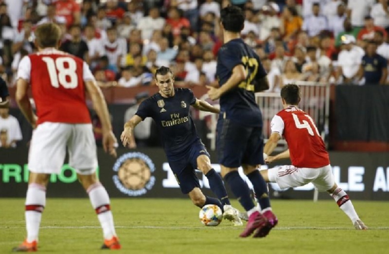 Bale makes goalscoring return as Real edge Arsenal on penalties
