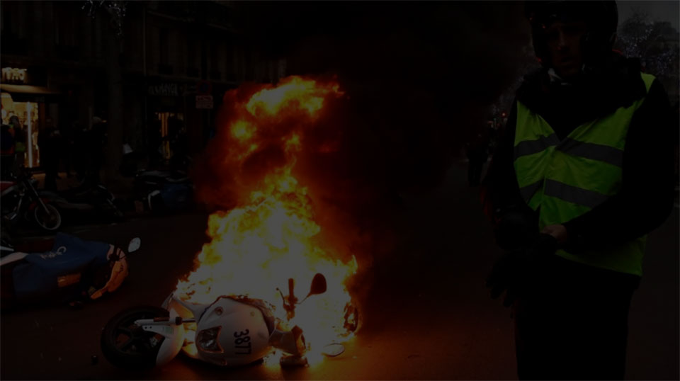 Clashes erupt in Paris as 'yellow vests' protest at unrepentant Macron