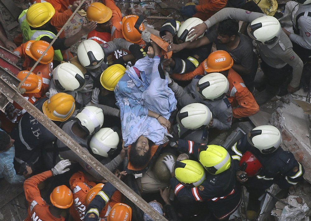 Rescuers look for survivors after building collapse in India