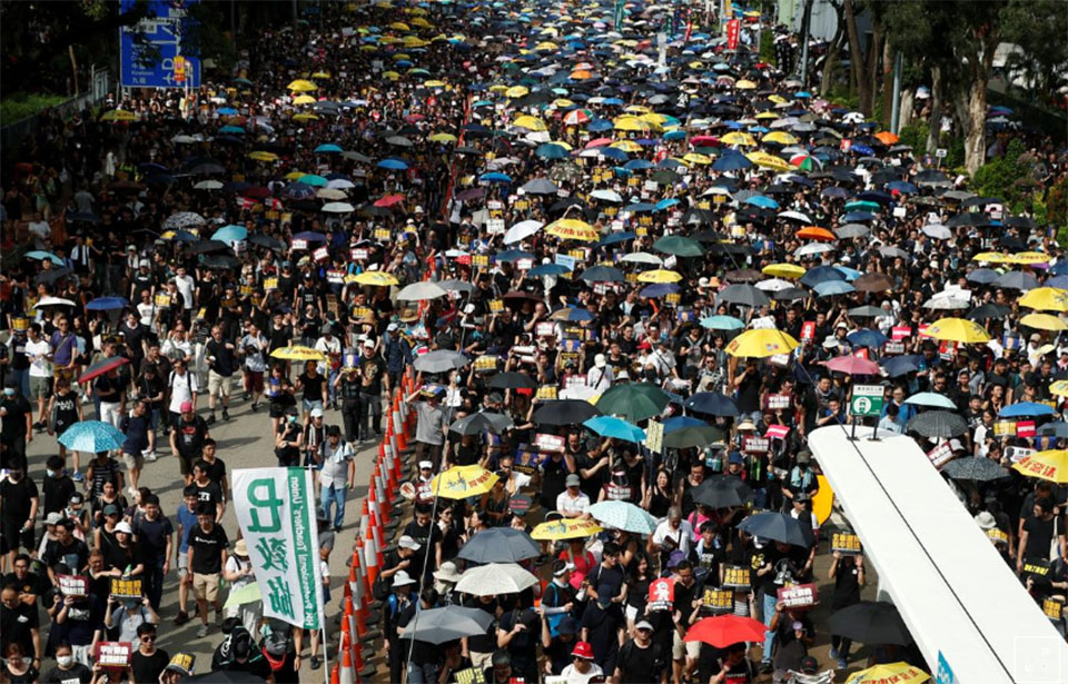 Hong Kong on security alert as thousands march in fresh wave of protests