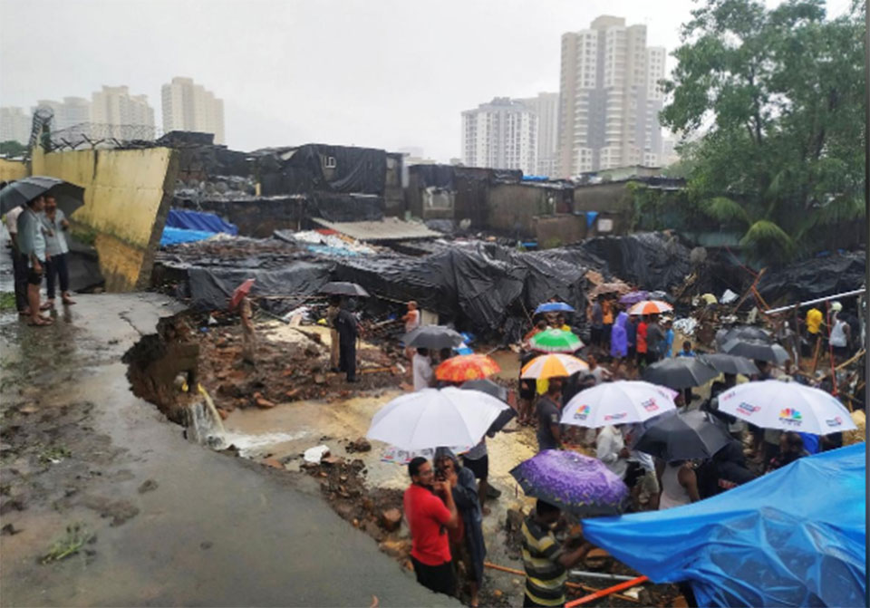 Heavy rains in India's Mumbai cause wall collapse that kills 13