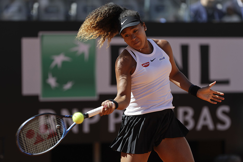 Osaka wins first of 2 matches in a busy day at Italian Open