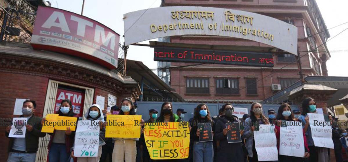IN PICS: Activists demonstrate in front of Immigration Department against proposed travel regulation for women