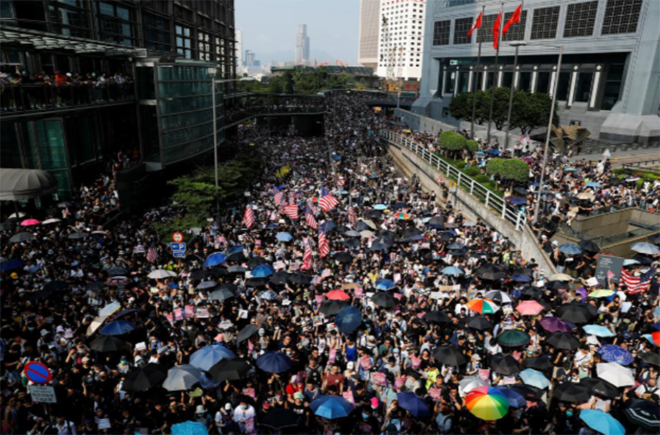 Hong Kong police fire tear gas as clashes erupt after thousands appeal to Trump