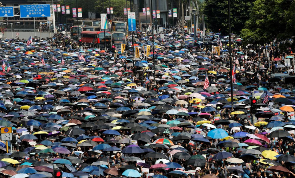 Thousands of Hong Kong protesters stage illegal march; metro stations ...