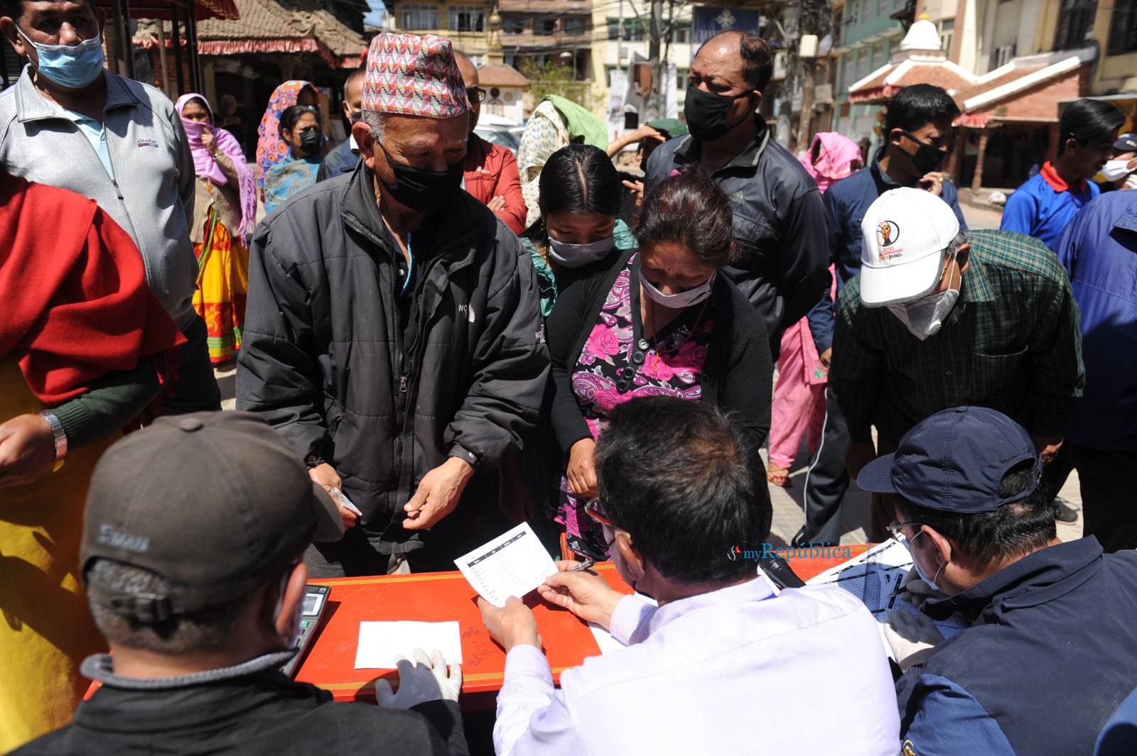 People queuing up at fair price shops in Patan without maintaining social distancing (with photos)